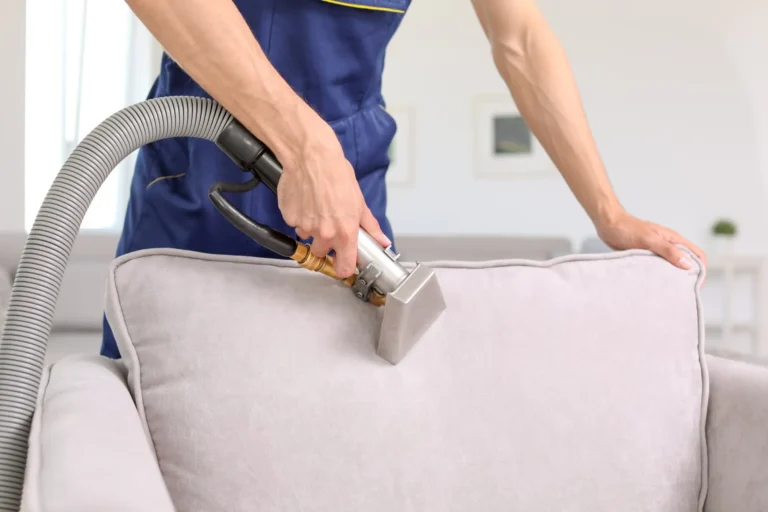 stock-photo-dry-cleaning-worker-removing-dirt-from-armchair-indoors-1097662844-1920w